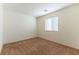 Bright bedroom featuring a large window and neutral wall colors at 3728 Discovery Creek Ave, North Las Vegas, NV 89031