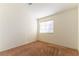 Simple bedroom with carpet flooring and a window with blinds at 3728 Discovery Creek Ave, North Las Vegas, NV 89031