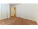 Well-lit bedroom with carpet flooring and mirrored closet doors at 3728 Discovery Creek Ave, North Las Vegas, NV 89031