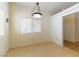 Dining room with tile flooring and a chandelier at 3728 Discovery Creek Ave, North Las Vegas, NV 89031