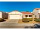 Single-story home with two-car garage and desert landscaping at 3728 Discovery Creek Ave, North Las Vegas, NV 89031