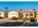 Single-story home with two-car garage and desert landscaping at 3728 Discovery Creek Ave, North Las Vegas, NV 89031