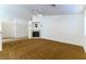 Spacious living room featuring a fireplace and carpet flooring at 3728 Discovery Creek Ave, North Las Vegas, NV 89031