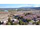 Aerial view of a desert community showcasing red-tiled roofs and stunning mountain backdrop at 3790 Desert Marina Dr # 147, Laughlin, NV 89029