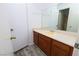 Bathroom featuring a light yellow sink, laminate flooring, and a mirror over the vanity at 3790 Desert Marina Dr # 147, Laughlin, NV 89029