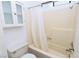 The bathroom features a shower-tub combo with white shower curtain and built-in shelves and cabinet at 3790 Desert Marina Dr # 147, Laughlin, NV 89029