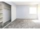 An empty bedroom featuring neutral gray carpeting and a sliding door closet to the left at 3790 Desert Marina Dr # 147, Laughlin, NV 89029