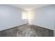 A bright bedroom with neutral gray carpet, light blue walls, and windows covered with window blinds at 3790 Desert Marina Dr # 147, Laughlin, NV 89029