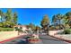 Gated community entrance with mature trees and manicured landscaping at 3790 Desert Marina Dr # 147, Laughlin, NV 89029