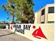 Laughlin Bay Village community sign featuring a red sailboat on a sunny day at 3790 Desert Marina Dr # 147, Laughlin, NV 89029