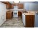 Functional kitchen featuring wood cabinets, laminate countertops, and modern appliances at 3790 Desert Marina Dr # 147, Laughlin, NV 89029