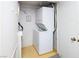 Functional laundry area with stacked washer and dryer and tile flooring at 3790 Desert Marina Dr # 147, Laughlin, NV 89029
