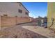 Small, fenced backyard with AC unit and side yard at 3929 Pepper Thorn Ave # 101, North Las Vegas, NV 89081