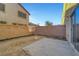 Private backyard with small patio and block wall at 3929 Pepper Thorn Ave # 101, North Las Vegas, NV 89081