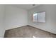 Bright bedroom with carpet flooring and a window at 3929 Pepper Thorn Ave # 101, North Las Vegas, NV 89081