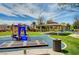 Community playground with play structures, shaded seating, and trash receptacle at 3929 Pepper Thorn Ave # 101, North Las Vegas, NV 89081