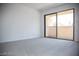 Bright bedroom with sliding door to balcony at 3937 S Torrey Pines Dr, Las Vegas, NV 89103