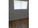 Bright bedroom with wood-look flooring and window at 3937 S Torrey Pines Dr, Las Vegas, NV 89103