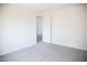 Spacious bedroom with neutral carpeting and door to hallway at 3937 S Torrey Pines Dr, Las Vegas, NV 89103