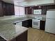 Kitchen with granite countertops and modern appliances at 3937 S Torrey Pines Dr, Las Vegas, NV 89103