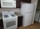 White appliances and granite countertops in kitchen at 3937 S Torrey Pines Dr, Las Vegas, NV 89103