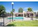 Community swimming pool with surrounding lawn and fence at 3937 S Torrey Pines Dr, Las Vegas, NV 89103