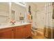 Bathroom vanity with cabinet storage, decorative mirror, and shower-tub combination at 3975 N Hualapai Way # 293, Las Vegas, NV 89129