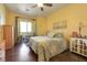 Spacious bedroom with king-size bed and hardwood floors at 3975 N Hualapai Way # 293, Las Vegas, NV 89129