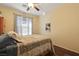 Bedroom with ceiling fan and large window at 3975 N Hualapai Way # 293, Las Vegas, NV 89129