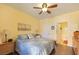 Bright bedroom with a ceiling fan and ensuite access at 3975 N Hualapai Way # 293, Las Vegas, NV 89129