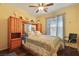 Bedroom with ceiling fan and built-in shelving at 3975 N Hualapai Way # 293, Las Vegas, NV 89129