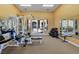 Well-equipped gym with exercise machines, free weights, and mirrored walls at 3975 N Hualapai Way # 293, Las Vegas, NV 89129