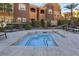 Community hot tub featuring tile accents and concrete pool surround at 3975 N Hualapai Way # 293, Las Vegas, NV 89129