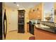 Well-equipped kitchen, featuring black appliances and ample cabinetry at 3975 N Hualapai Way # 293, Las Vegas, NV 89129