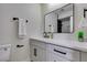 Modern bathroom with white vanity, black accents, and a walk-in shower at 3994 Avonwood Ave, Las Vegas, NV 89121