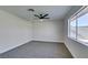 Spacious bedroom with grey carpet, ceiling fan and window at 3994 Avonwood Ave, Las Vegas, NV 89121