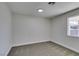 Spacious bedroom with grey carpet and a window at 3994 Avonwood Ave, Las Vegas, NV 89121