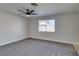 Spacious bedroom with grey carpet, ceiling fan and window at 3994 Avonwood Ave, Las Vegas, NV 89121