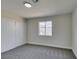 Bright bedroom featuring grey carpet and double door closet at 3994 Avonwood Ave, Las Vegas, NV 89121