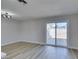 Bright dining area with sliding doors and wood-look floors at 3994 Avonwood Ave, Las Vegas, NV 89121