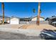 Updated single story home with gray exterior and landscaped front yard at 3994 Avonwood Ave, Las Vegas, NV 89121