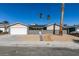 Updated single story home with gray exterior and landscaped front yard at 3994 Avonwood Ave, Las Vegas, NV 89121