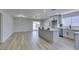 Modern kitchen with island, stainless steel appliances, and light gray cabinets at 3994 Avonwood Ave, Las Vegas, NV 89121