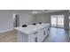 Kitchen island with white quartz countertop and black hardware at 3994 Avonwood Ave, Las Vegas, NV 89121