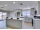 Modern kitchen featuring island, stainless steel appliances, and white cabinets at 3994 Avonwood Ave, Las Vegas, NV 89121