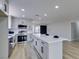 Modern kitchen with island and gray cabinets at 3994 Avonwood Ave, Las Vegas, NV 89121