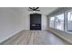 Living room features a modern fireplace and wood-look flooring at 3994 Avonwood Ave, Las Vegas, NV 89121