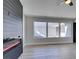 Living room with fireplace, large windows, and light flooring at 3994 Avonwood Ave, Las Vegas, NV 89121