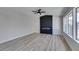 Living room boasting a linear fireplace and wood-look floors at 3994 Avonwood Ave, Las Vegas, NV 89121