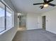 Main bedroom with grey carpet, ceiling fan and ensuite bathroom at 3994 Avonwood Ave, Las Vegas, NV 89121